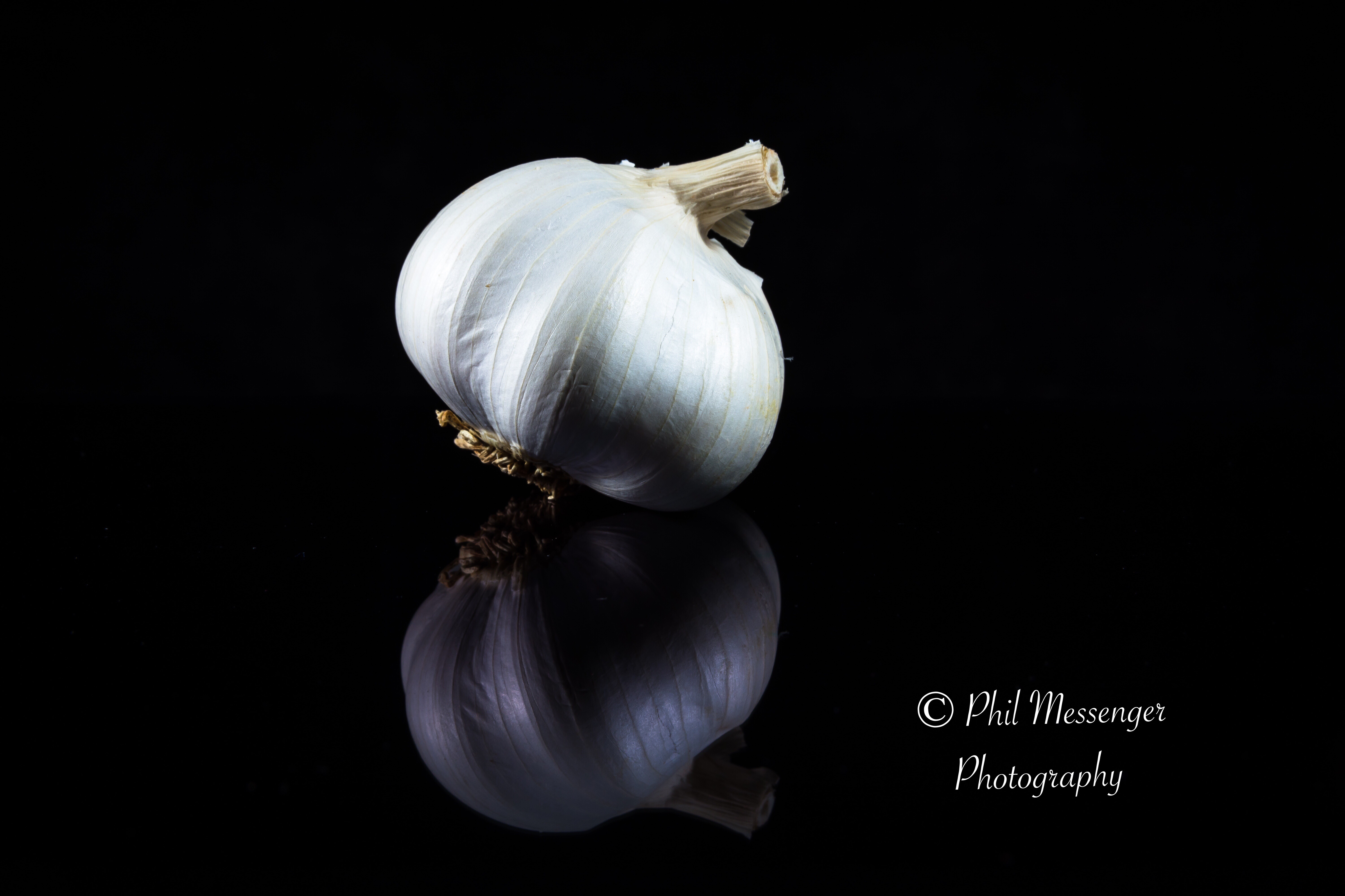 Garlic bulb on black