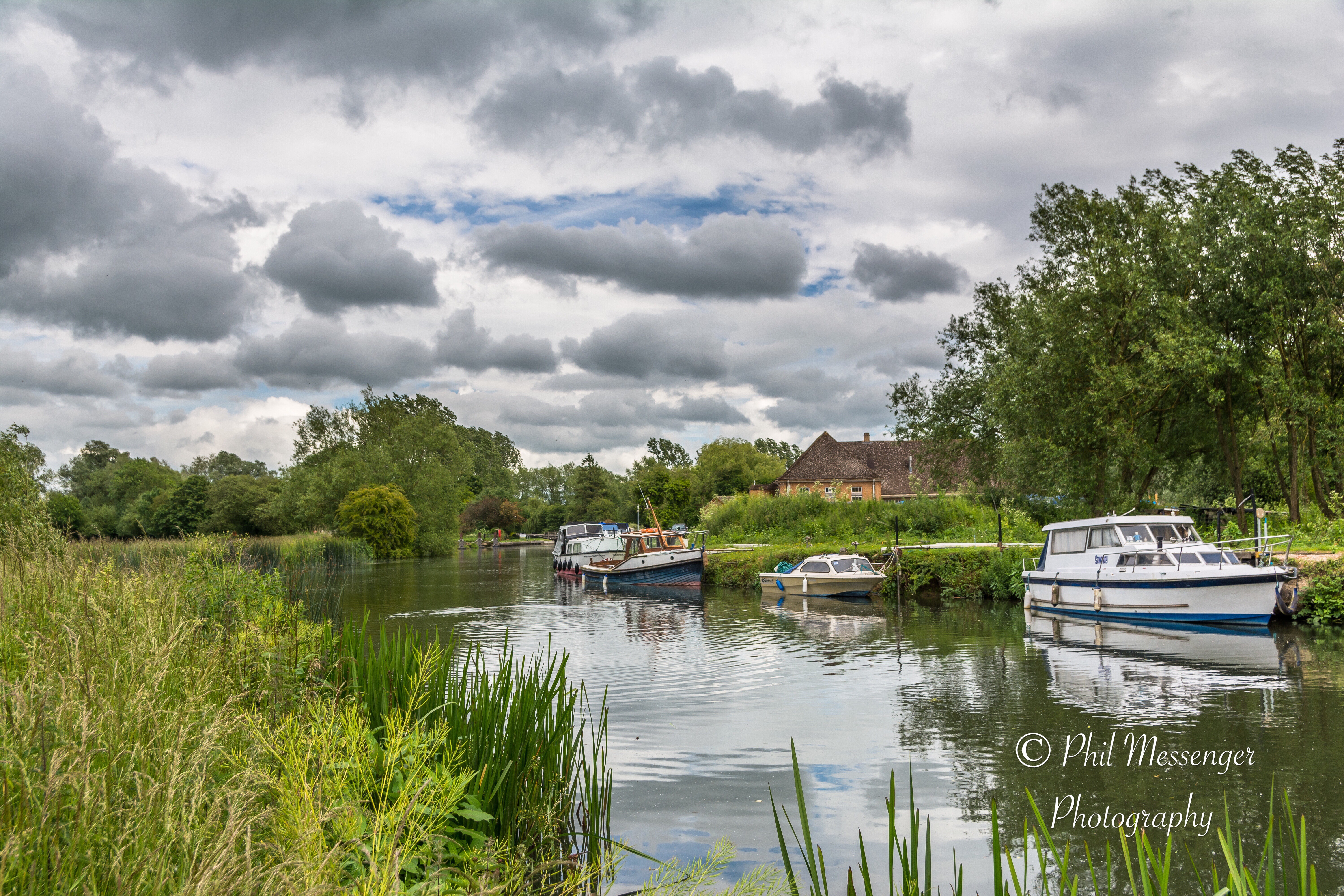 Boats Moored at Buscot, Oxfordshire on a cloudy windy Sunday.