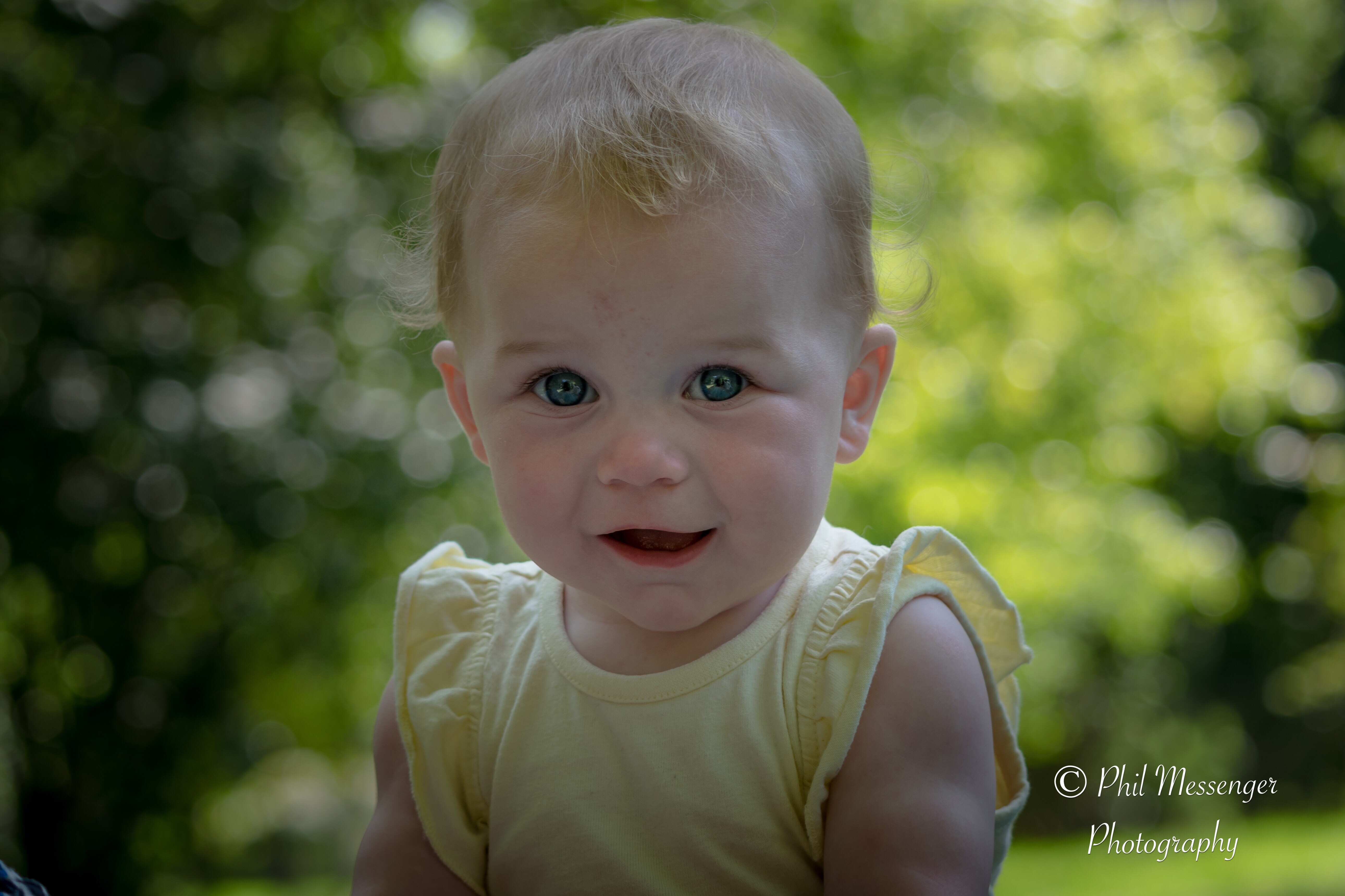 Baby head shot with Erin at the park.