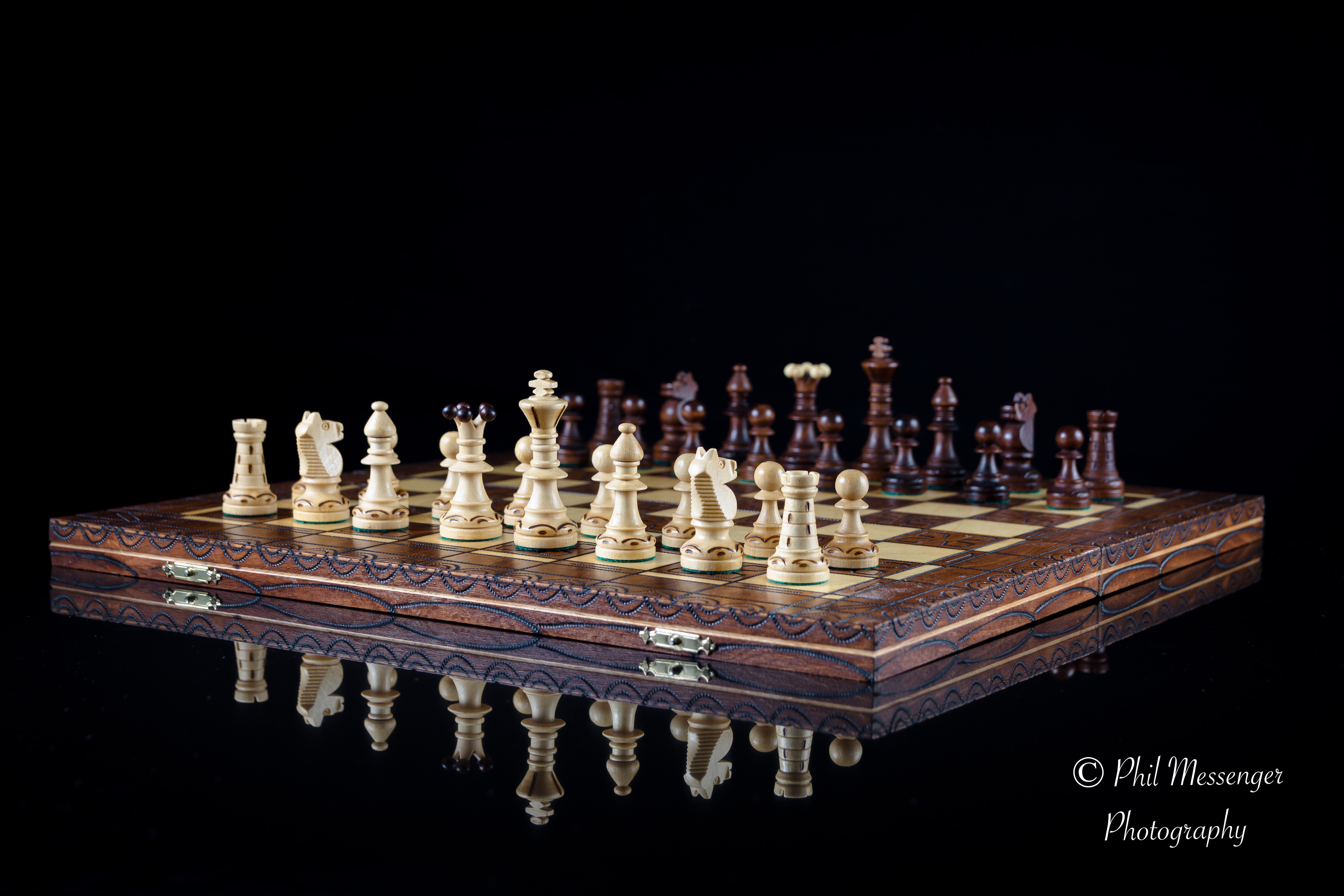 chess set on black back background 