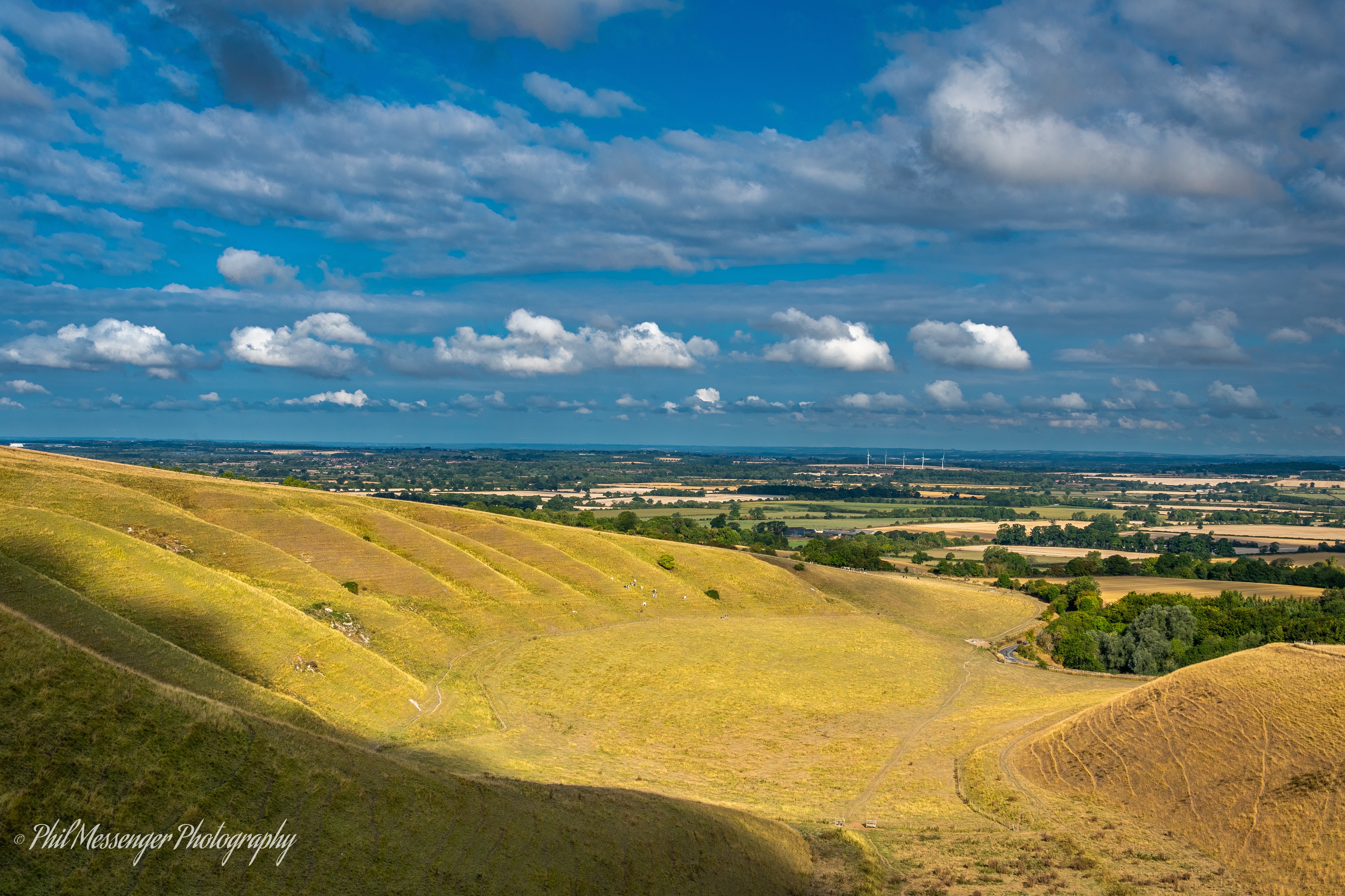 Looking out towards Watchfield turbines from White Horse Hill Uffington Oxfordshire.