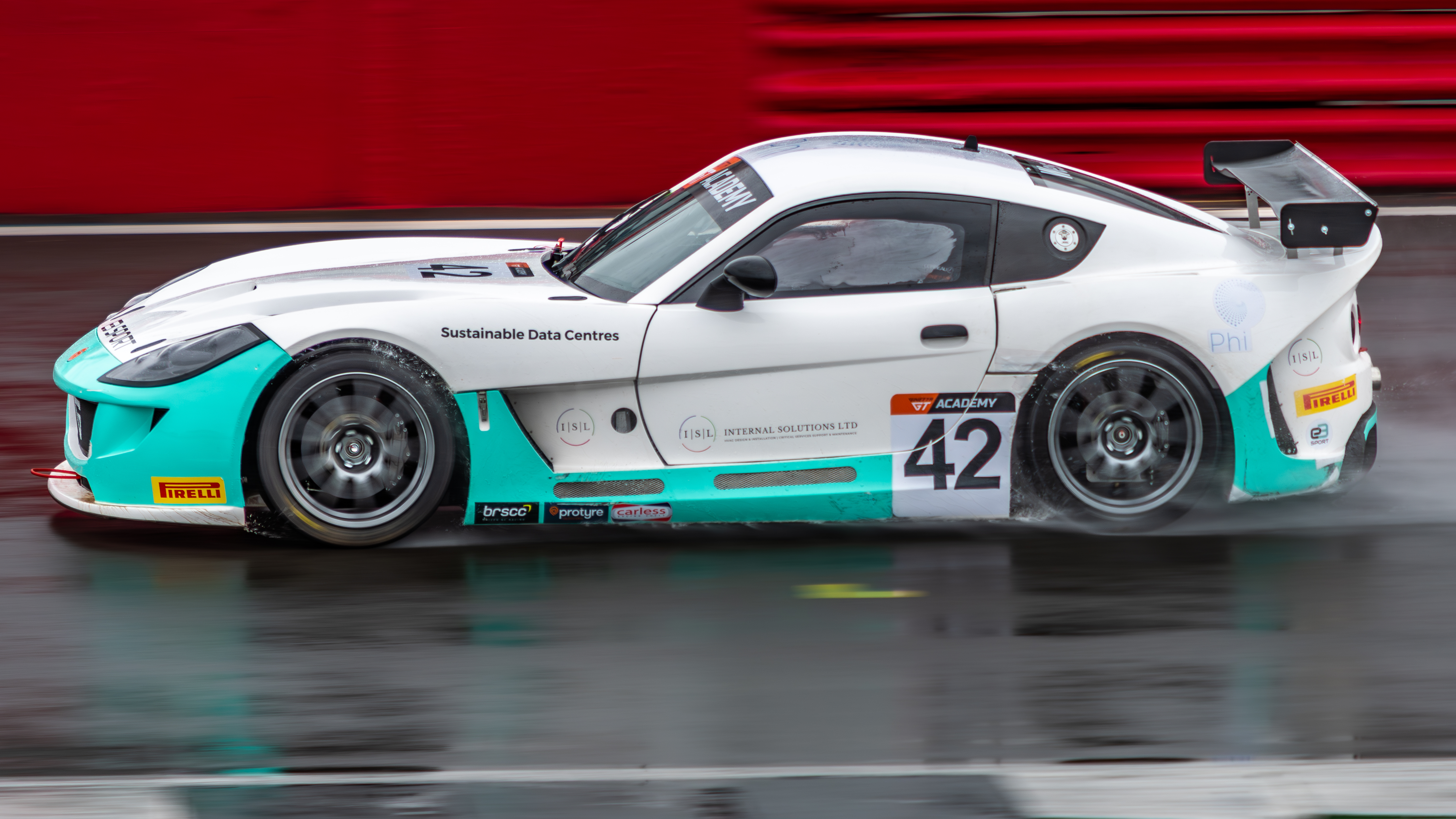 A couple more from Silverstone last week, Ginetta GT in the wet.